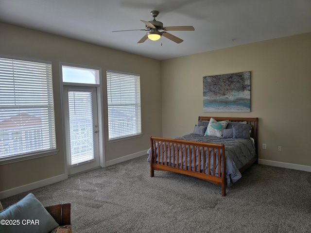 carpeted bedroom with ceiling fan, multiple windows, and access to outside