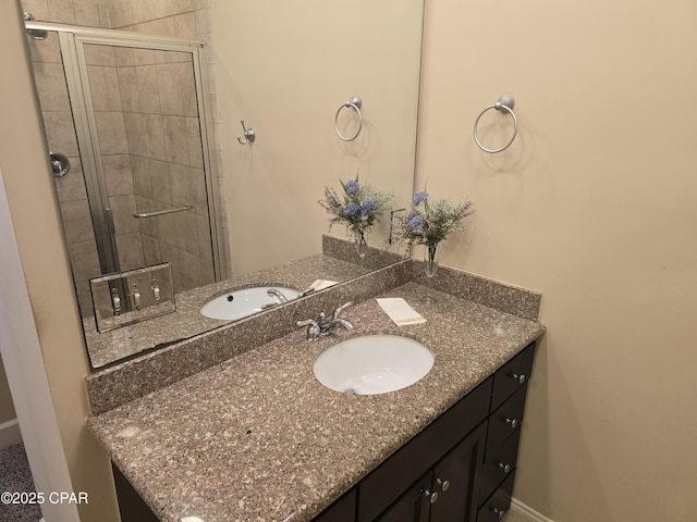 bathroom with vanity and an enclosed shower