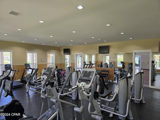 workout area with wooden walls