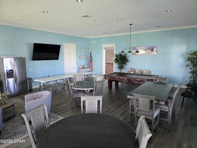 dining room featuring ornamental molding and dark hardwood / wood-style flooring