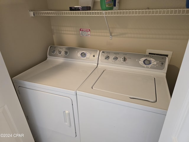 laundry area with independent washer and dryer