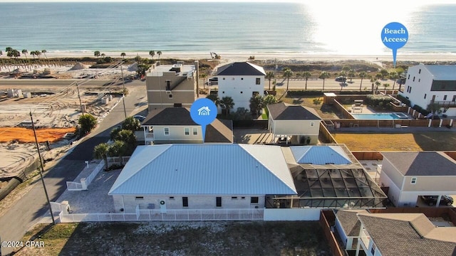 birds eye view of property with a water view, a residential view, and a view of the beach