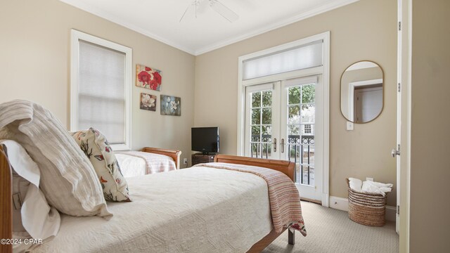 carpeted bedroom with ceiling fan, ornamental molding, french doors, and access to exterior