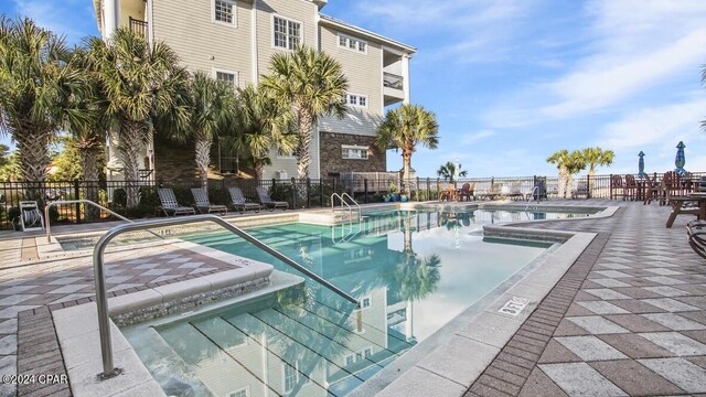 view of pool featuring a hot tub