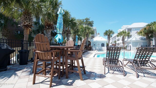 view of patio / terrace featuring a fenced in pool