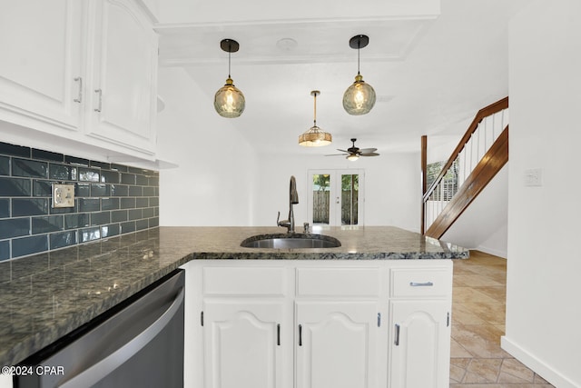 kitchen with dishwasher, decorative backsplash, white cabinetry, and sink