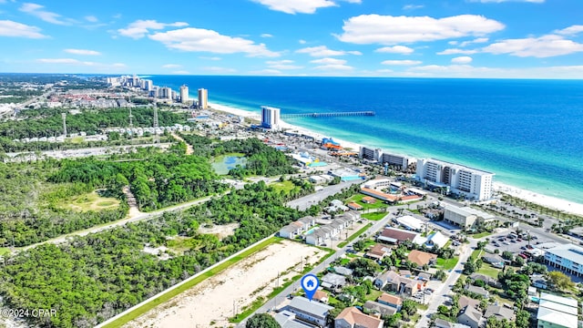 birds eye view of property with a view of the beach and a water view