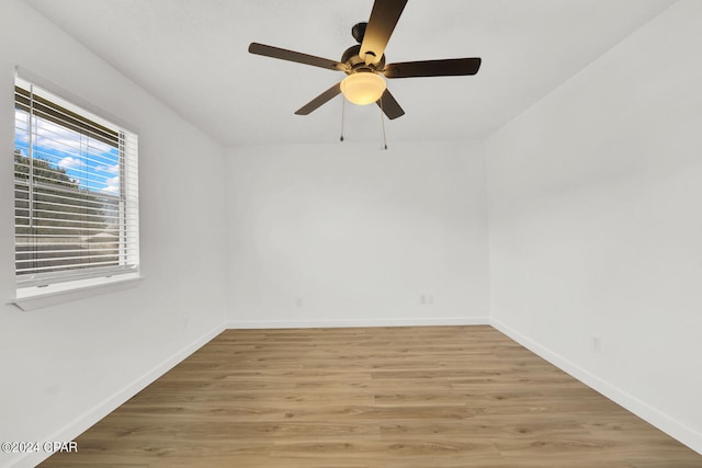 empty room featuring ceiling fan and wood-type flooring