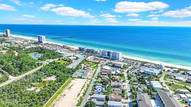 bird's eye view featuring a water view and a beach view