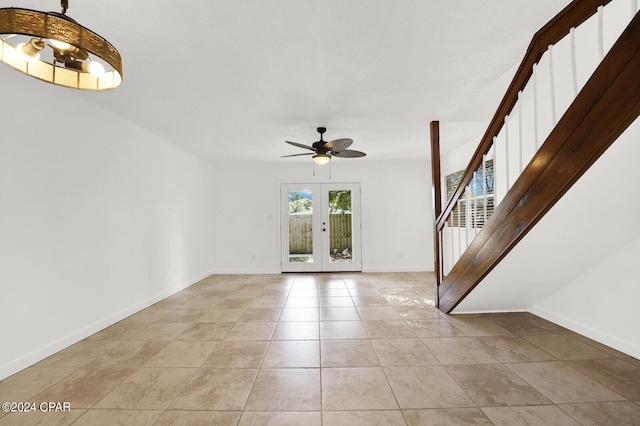 unfurnished room with light tile patterned floors, ceiling fan, and french doors