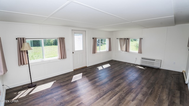 interior space with a wall mounted air conditioner and dark wood-type flooring