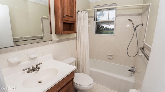 full bathroom with ornamental molding, vanity, shower / tub combo, and toilet