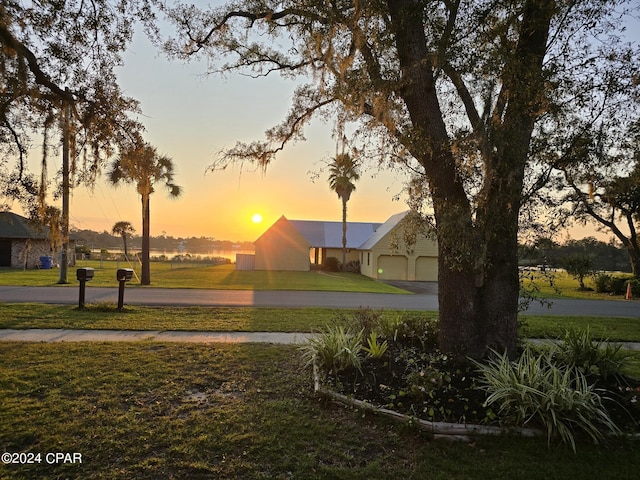 view of home's community featuring a lawn