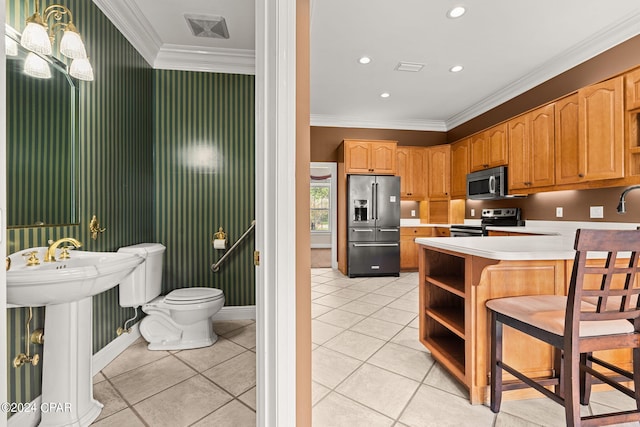 kitchen with hanging light fixtures, kitchen peninsula, light tile patterned floors, stainless steel appliances, and ornamental molding