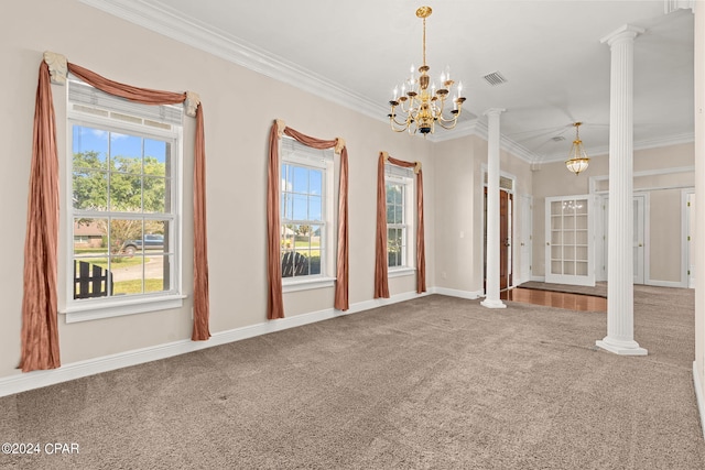 spare room featuring a chandelier, carpet floors, and ornate columns