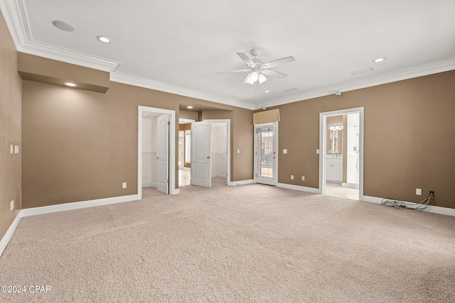 spare room with ornamental molding, ceiling fan, and light carpet