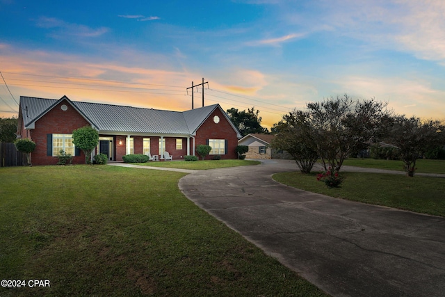 view of front of property with a lawn