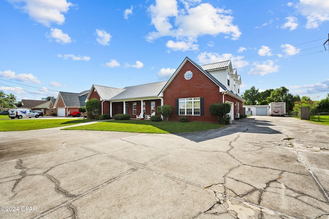 view of front of house featuring a front yard and a garage