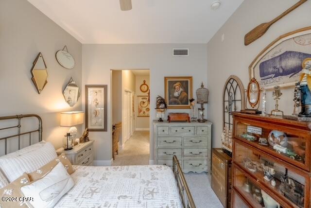 carpeted bedroom with ceiling fan