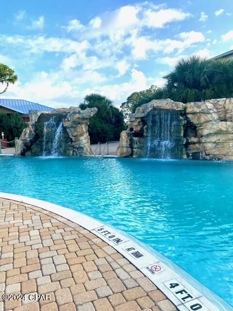 view of pool featuring pool water feature