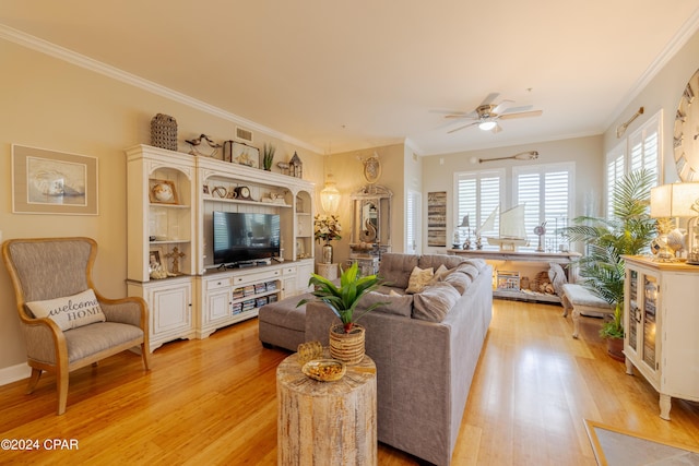 living room with ceiling fan, light hardwood / wood-style floors, and ornamental molding