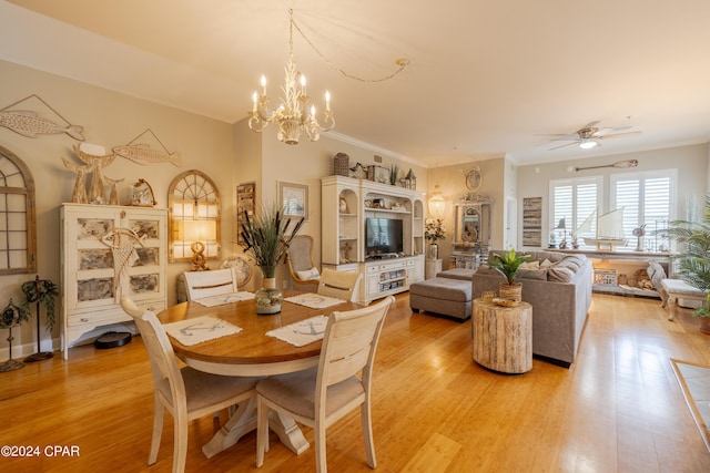 dining space featuring ceiling fan with notable chandelier, light hardwood / wood-style floors, and ornamental molding