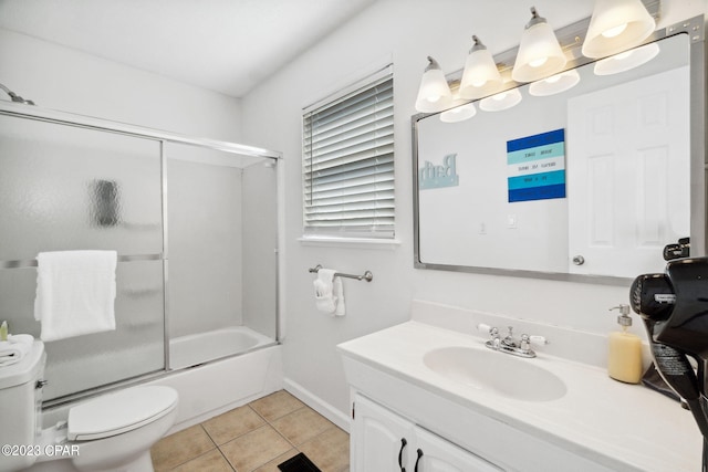 full bathroom with combined bath / shower with glass door, vanity, toilet, and tile patterned flooring