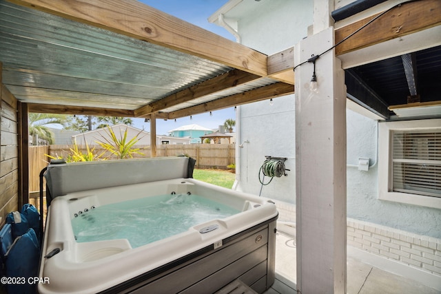 view of patio / terrace featuring a hot tub