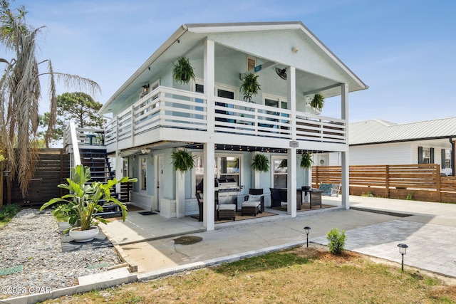 rear view of house with a patio