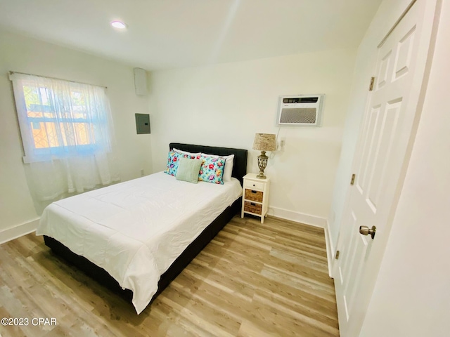 bedroom with hardwood / wood-style floors