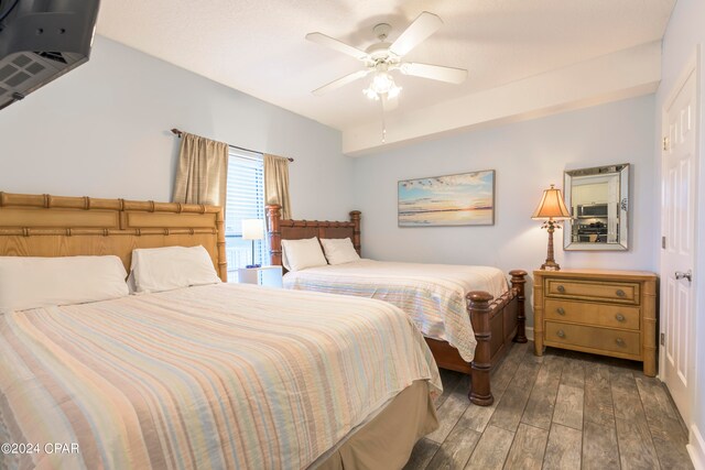 bedroom featuring dark hardwood / wood-style floors and ceiling fan