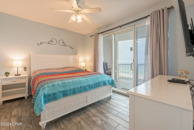 bedroom with ceiling fan, dark wood-type flooring, and access to exterior