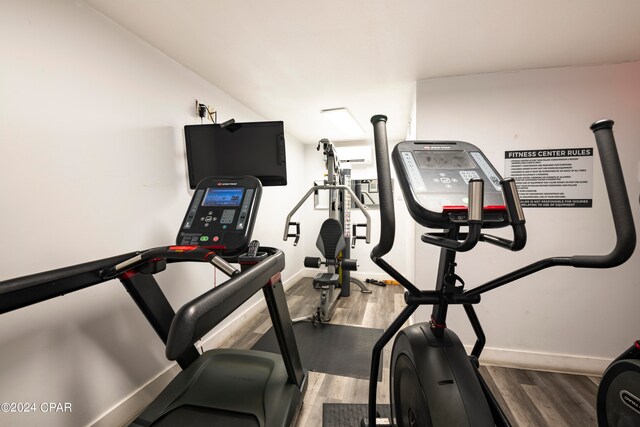 workout room featuring hardwood / wood-style floors