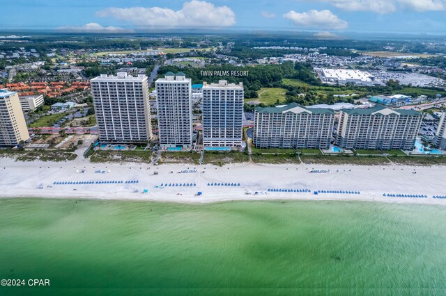 bird's eye view featuring a water view and a view of the beach