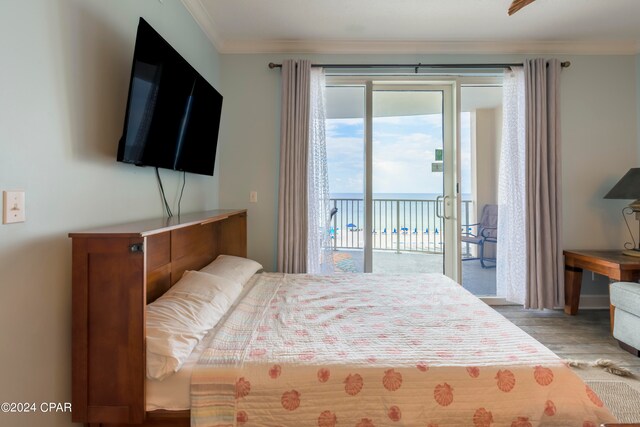 bedroom with light wood-type flooring, access to exterior, and crown molding