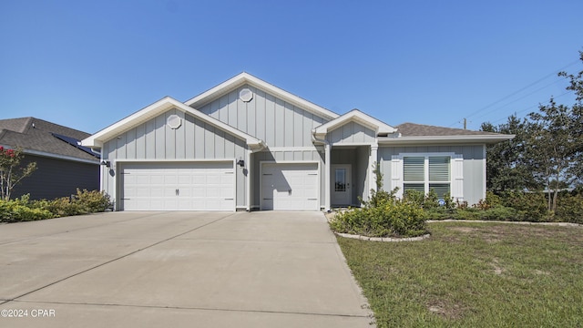 view of front of property with a garage and a front yard