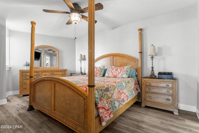 bedroom with hardwood / wood-style floors and ceiling fan