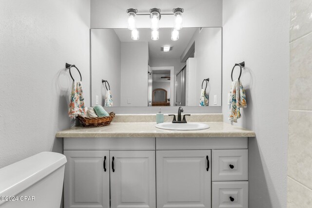 bathroom with vanity and toilet