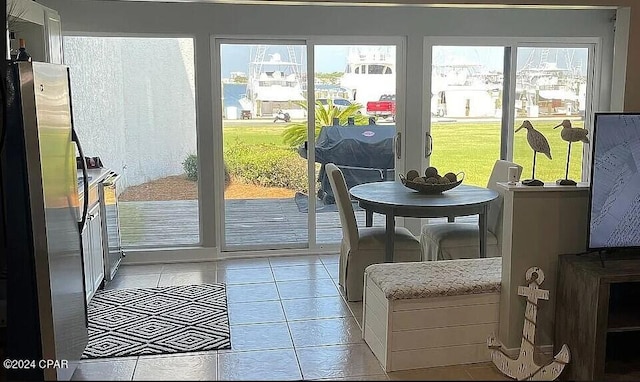 doorway to outside featuring plenty of natural light and light tile patterned floors