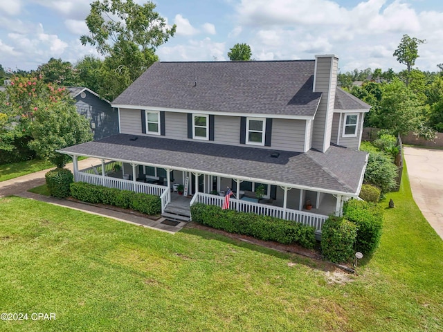 farmhouse-style home featuring a front yard and a porch