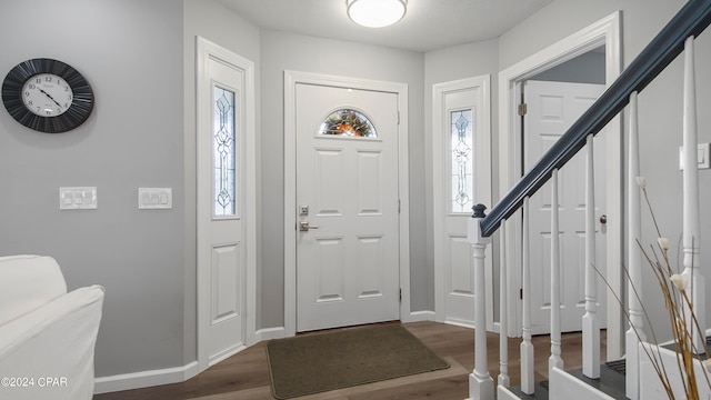 entrance foyer featuring dark hardwood / wood-style floors