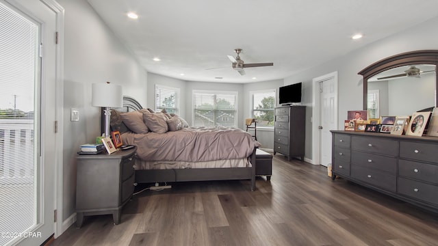 bedroom with ceiling fan and dark hardwood / wood-style flooring