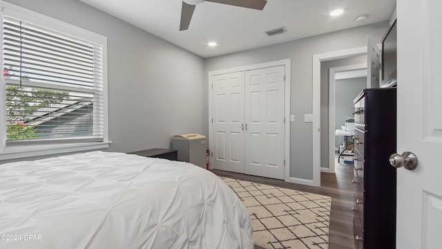 bedroom with a closet, ceiling fan, and wood-type flooring