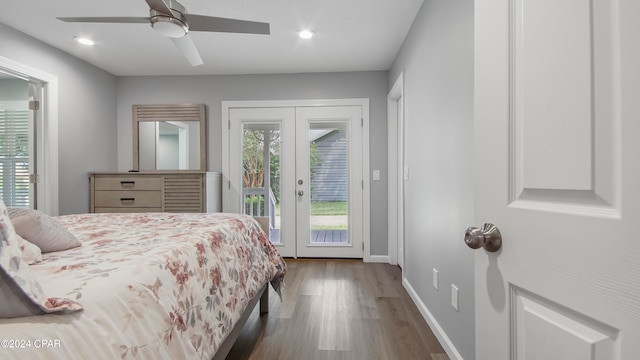 bedroom featuring access to outside, dark hardwood / wood-style floors, french doors, and ceiling fan