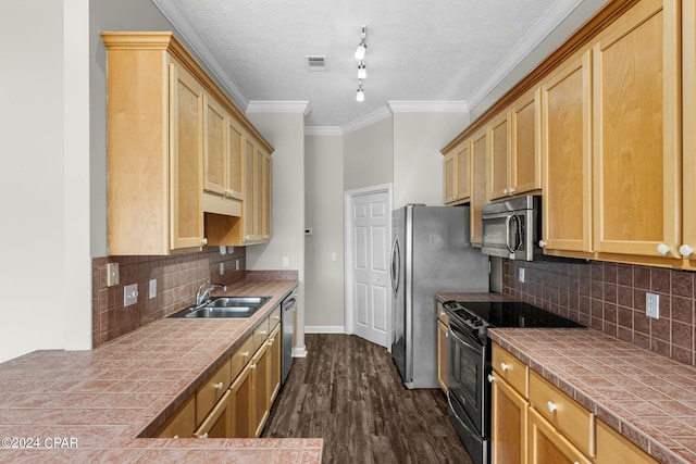 kitchen featuring ceiling fan, plenty of natural light, dark hardwood / wood-style flooring, and a tile fireplace