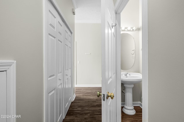 stairs featuring a textured ceiling, ornamental molding, track lighting, and hardwood / wood-style flooring