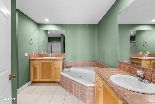 bathroom with vanity, an enclosed shower, and tile patterned floors