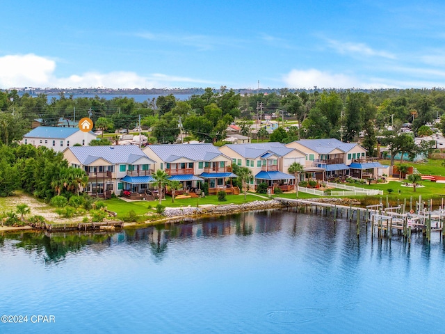 birds eye view of property with a water view