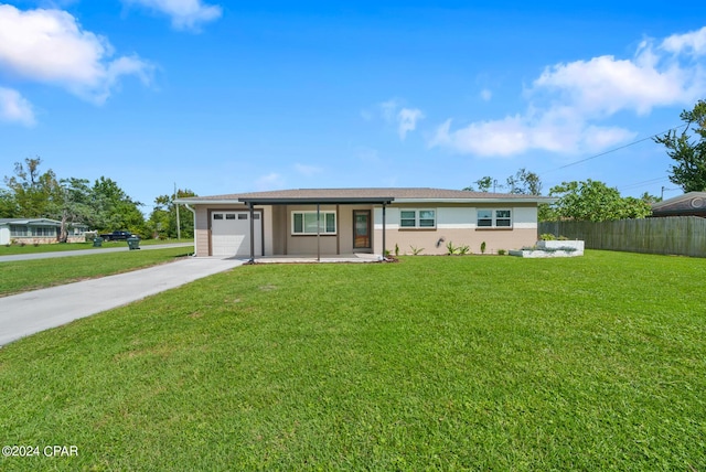 single story home featuring a front yard and a garage