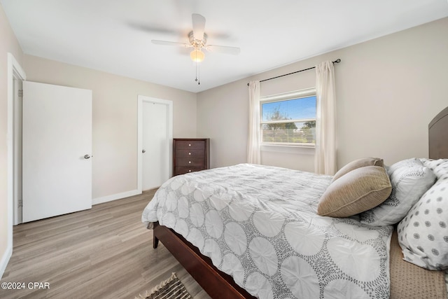 bedroom featuring light hardwood / wood-style floors and ceiling fan